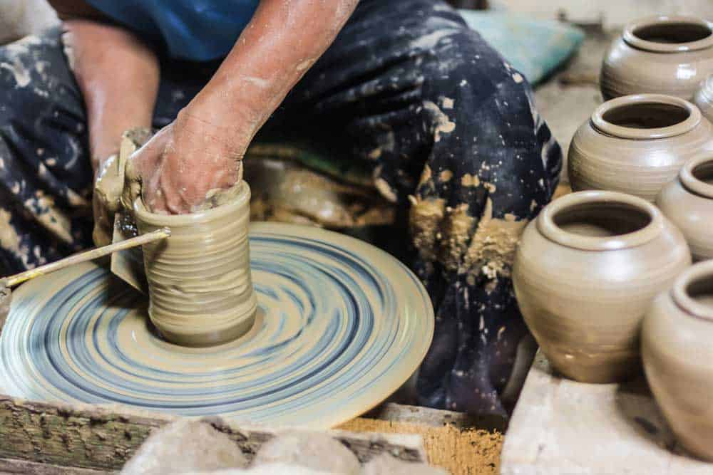 man using a pottery wheel